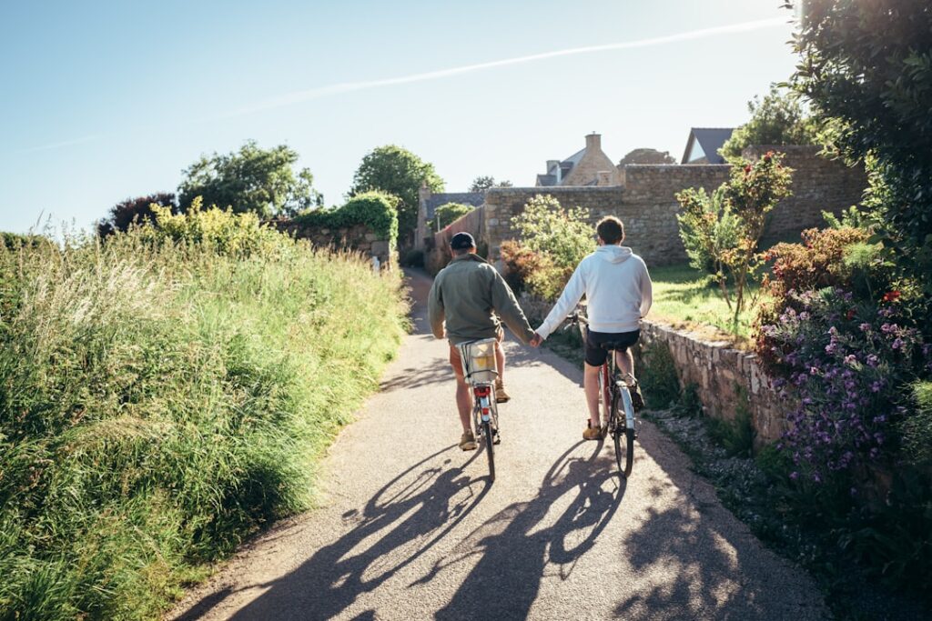 Couple riding e-bikes together in the countryside